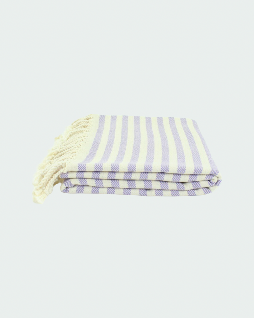 Turkish cotton peshtemal, thin beach towels in striped design in light lilac color.