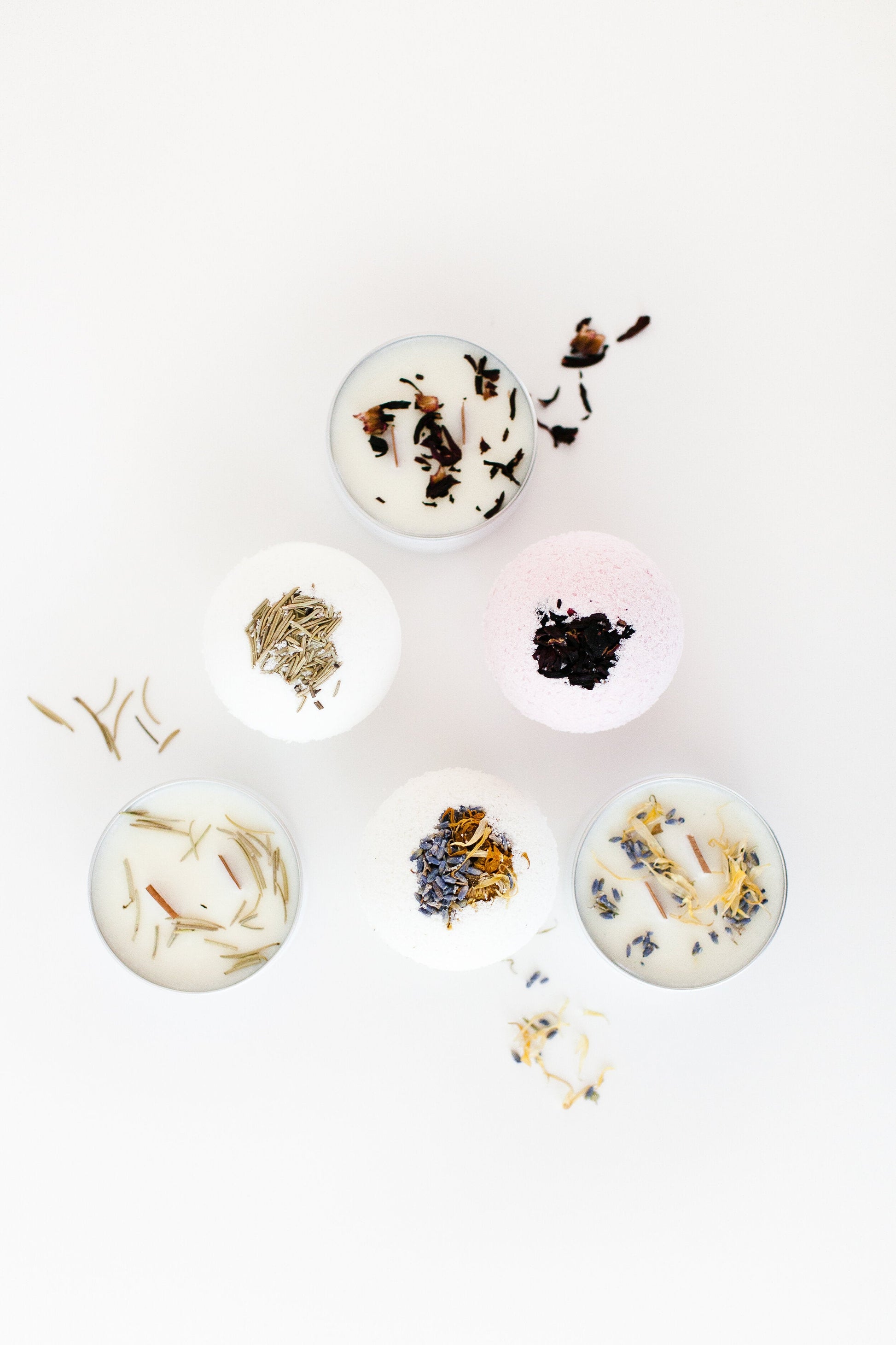 A set of bath bombs handcrafted in shape of a ball topped with natural dried rose petals and lavender.