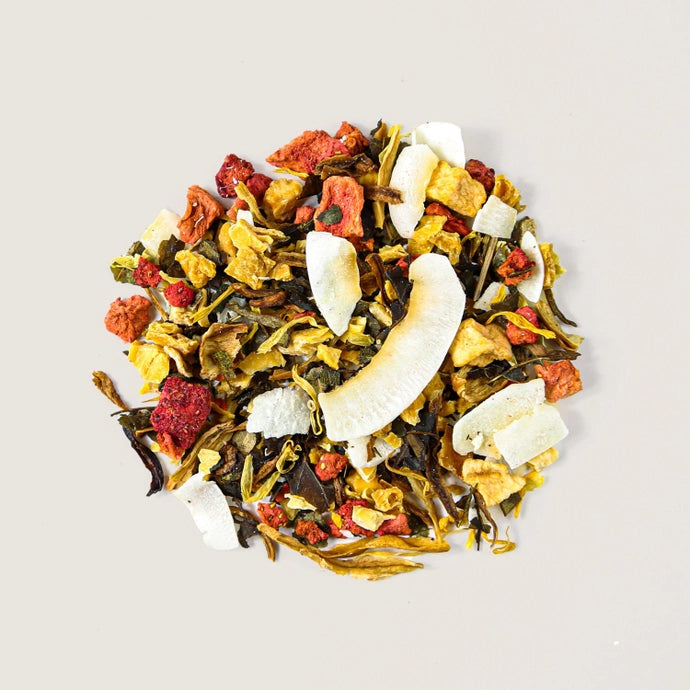 A pile of loose tea leaves of organic herbal tropical  tea.