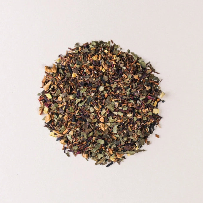 A pile of loose tea leaves of organic herbal hibiscus tea.