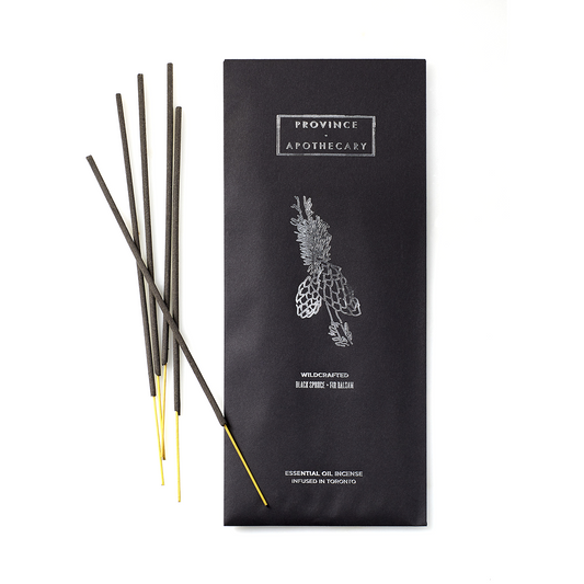 A set of incense sticks infused with essential oils by Province Apothecary, with the black packaging, in black spruce and fir balsam scent.