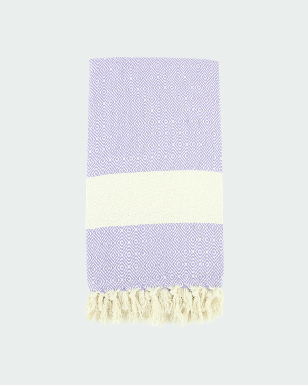 Turkish cotton peshtemal, thin beach towels in diamond design, in white and light lilac color.