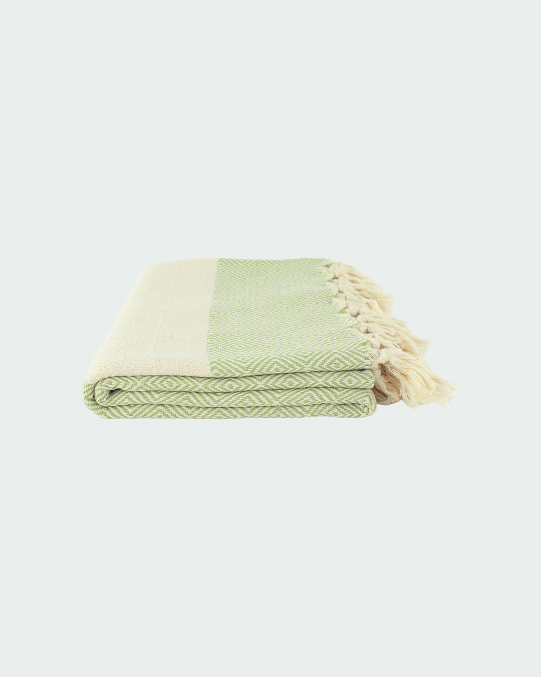 Turkish cotton peshtemal, thin beach towels in diamond design, in white and light pistachio green color.