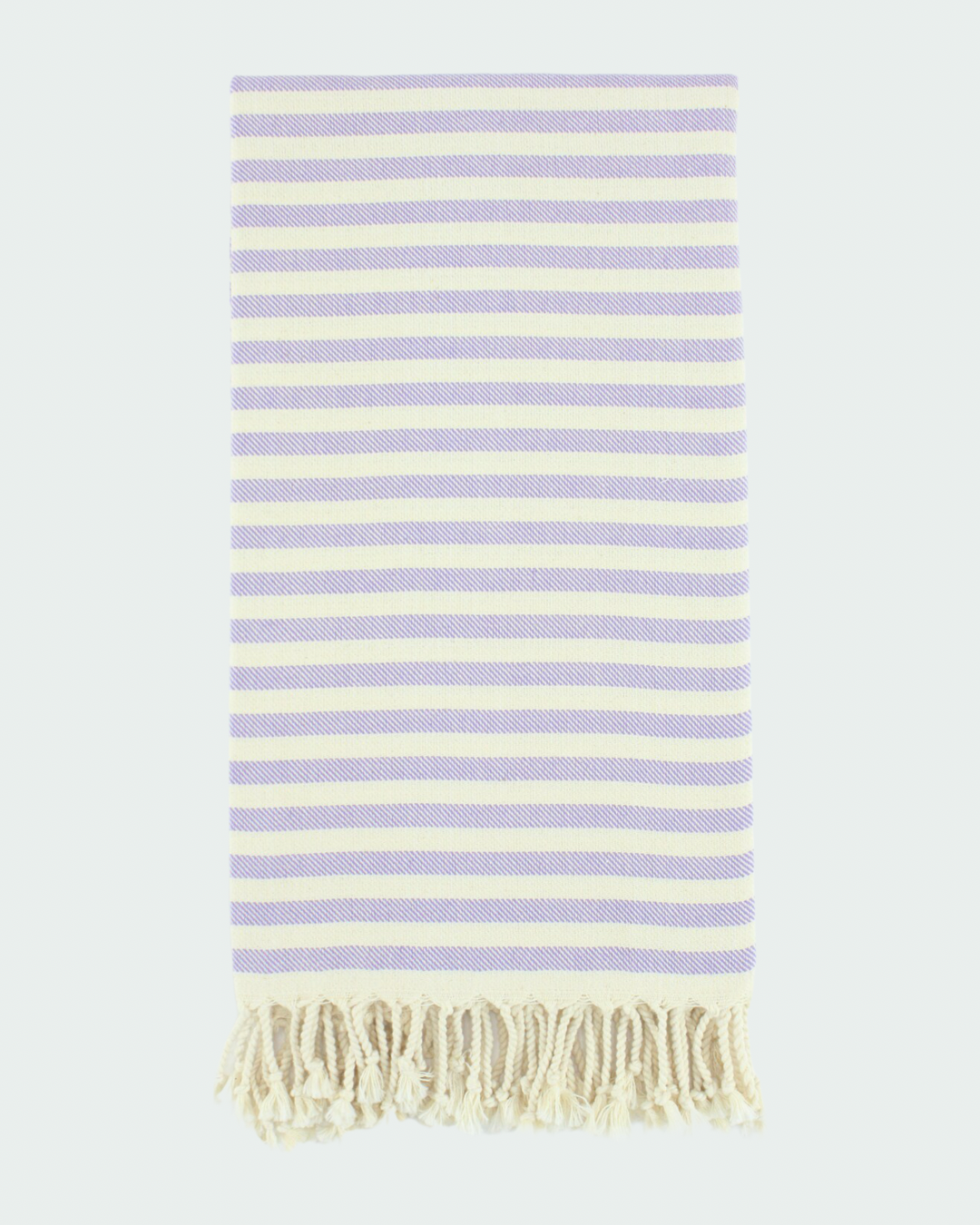 Turkish cotton peshtemal, thin beach towels in striped design in light lilac color.