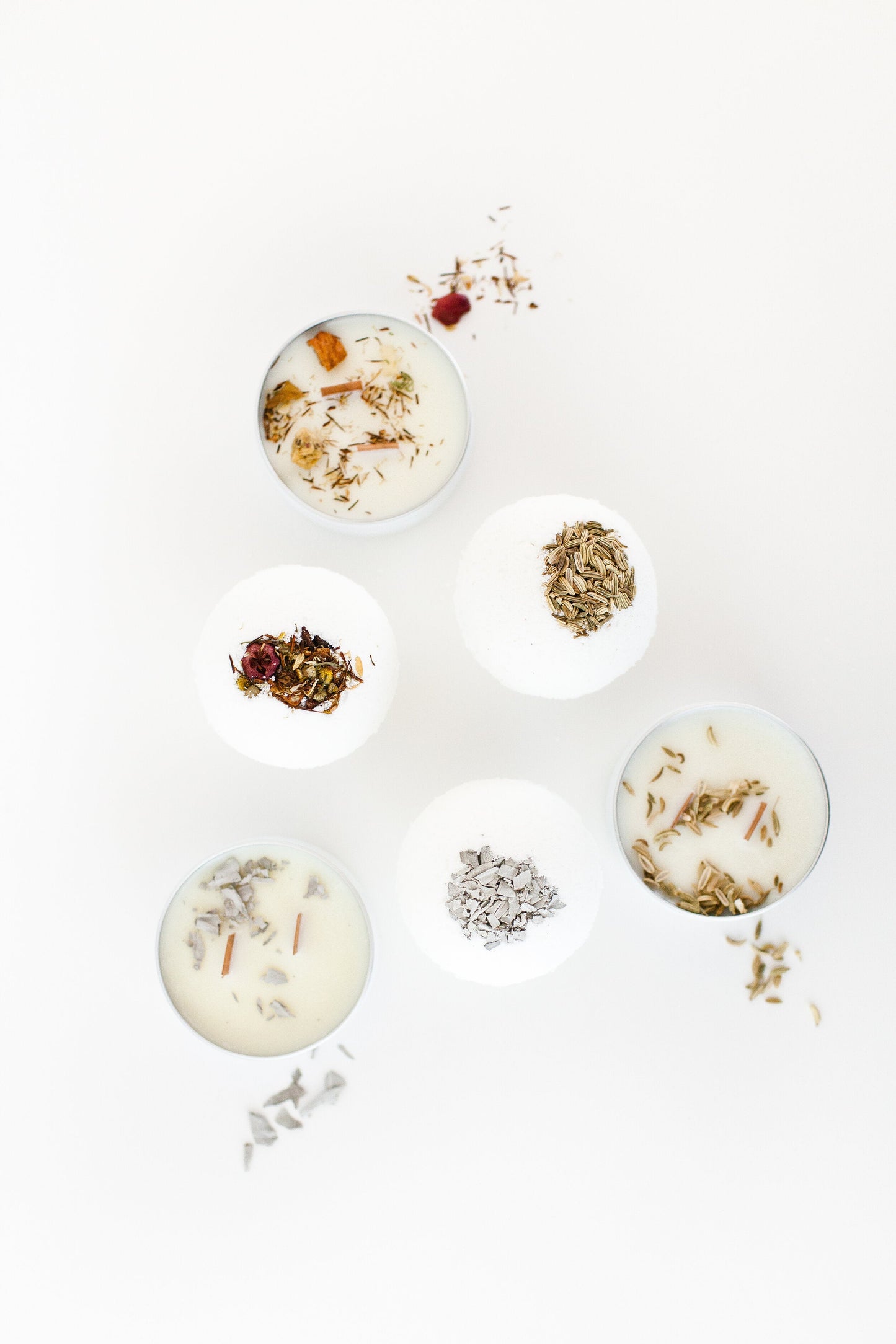 A set of bath bombs handcrafted in shape of a ball topped with natural dried rose petals and lavender.