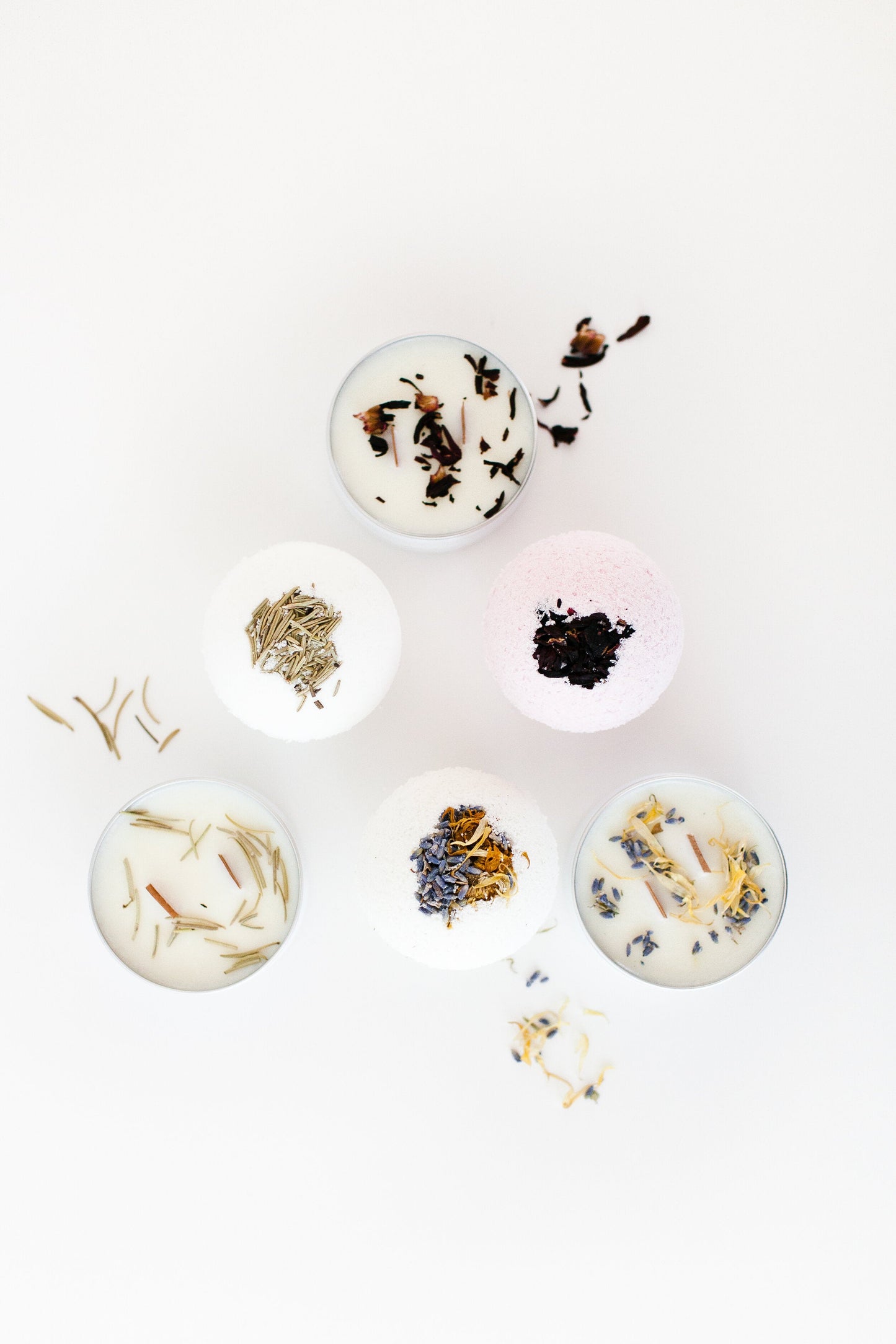 A set of bath bombs handcrafted in shape of a ball topped with natural dried rose petals and lavender. 